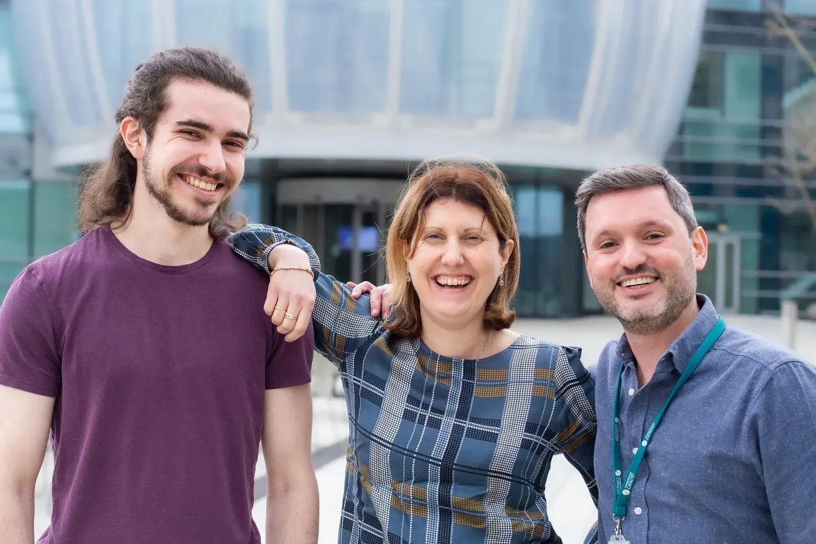 Three members of the Neobe team outside the Stevenage Bioscience Catalyst building.